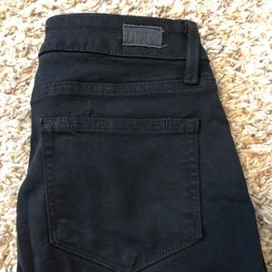 Distressed black skinny jeans